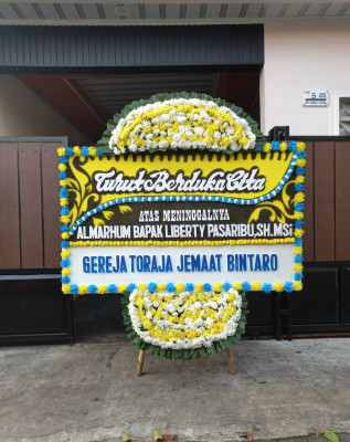 Papan Bunga Duka di Punia